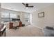 Bright office space with a ceiling fan, two windows, neutral carpet, and a cozy chair, ideal for a productive work environment at 132 Daniels Ridge Dr, Summerville, SC 29485
