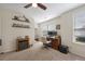 Spacious office area features carpet flooring, a ceiling fan, and shelving, providing a functional and comfortable work space at 132 Daniels Ridge Dr, Summerville, SC 29485
