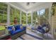 Bright sun room featuring large windows, comfortable furniture, and a ceiling fan at 132 Daniels Ridge Dr, Summerville, SC 29485