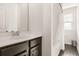 Bright bathroom featuring dark cabinets, a large mirror, and a combined shower and tub at 132 Wild Holly Dr, Moncks Corner, SC 29461