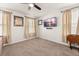 Cozy bedroom with ceiling fan, mounted television, and lots of natural light from two windows at 132 Wild Holly Dr, Moncks Corner, SC 29461