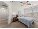 Bright bedroom with a comfortable bed, stylish nightstand, and sunny window at 132 Wild Holly Dr, Moncks Corner, SC 29461