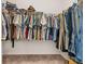 Organized walk-in closet with hanging racks filled with a variety of clothing at 132 Wild Holly Dr, Moncks Corner, SC 29461