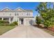 Charming two-story home with well-maintained lawn, landscaping, and attached garage at 132 Wild Holly Dr, Moncks Corner, SC 29461