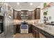 Modern kitchen with stainless steel appliances, granite countertops, and dark wood cabinetry at 132 Wild Holly Dr, Moncks Corner, SC 29461