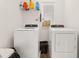 A bright laundry room with appliances, storage, and natural light at 132 Wild Holly Dr, Moncks Corner, SC 29461