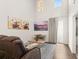Bright living room with hardwood floors, high ceilings and large windows that let in plenty of natural light at 132 Wild Holly Dr, Moncks Corner, SC 29461