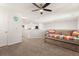 Upstairs bonus room with a comfortable sofa bed, neutral carpet, and a ceiling fan at 132 Wild Holly Dr, Moncks Corner, SC 29461