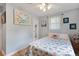 Bright bedroom with hardwood floors, coastal themed decor, ceiling fan, and lots of natural light at 1549 N Avalon Cir, Charleston, SC 29407