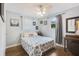 Cozy bedroom with hardwood floors, ceiling fan and marine themed decor with lots of natural light at 1549 N Avalon Cir, Charleston, SC 29407