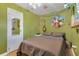 Quirky bedroom featuring a guitar and other music themed decor with mirror on the closet door at 1549 N Avalon Cir, Charleston, SC 29407