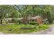 Traditional brick home with a lush front yard and established landscaping at 1549 N Avalon Cir, Charleston, SC 29407