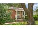 Inviting front porch featuring brick steps, a white railing, and partial shade at 1549 N Avalon Cir, Charleston, SC 29407