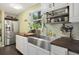 Well-lit kitchen features white cabinets, and stainless-steel appliances at 1549 N Avalon Cir, Charleston, SC 29407