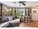Comfortable living room with hardwood floors, lots of natural light, and a ceiling fan at 1549 N Avalon Cir, Charleston, SC 29407