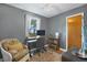 Comfortable home office with desk, chair, wood floors, natural light and stylish décor at 1549 N Avalon Cir, Charleston, SC 29407