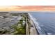 Stunning aerial view of beachfront homes along the coast, capturing the beauty of seaside living and ocean vistas at 1568 E Ashley Ave, Folly Beach, SC 29439