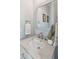 Elegant bathroom featuring a marble countertop, sleek fixtures, and a decorative mirror, exuding modern charm and style at 1568 E Ashley Ave, Folly Beach, SC 29439