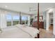 Inviting bedroom with dark wood furnishings, ceiling fan, and sliding doors that lead to the outdoor porch at 1568 E Ashley Ave, Folly Beach, SC 29439