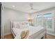 Bright bedroom featuring a white bed, shuttered windows, and light-colored walls for a serene and relaxing atmosphere at 1568 E Ashley Ave, Folly Beach, SC 29439