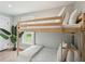 Cozy bunk bedroom with wooden frame, comfortable bedding, and a view to the outdoors, creating a youthful space at 1568 E Ashley Ave, Folly Beach, SC 29439