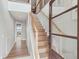 Bright entryway with hardwood floors, staircase, and stylish modern design details at 1568 E Ashley Ave, Folly Beach, SC 29439
