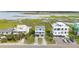 Charming coastal home with double balconies, offering picturesque marsh views in an elevated setting at 1568 E Ashley Ave, Folly Beach, SC 29439