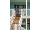 Close-up of the front door and porch steps, showcasing the home's entrance at 1568 E Ashley Ave, Folly Beach, SC 29439