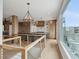 Modern kitchen with a large island, stainless steel appliances, balcony access, and view at 1568 E Ashley Ave, Folly Beach, SC 29439