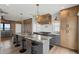 Open kitchen featuring an island with seating, stainless steel appliances, and custom cabinets at 1568 E Ashley Ave, Folly Beach, SC 29439