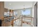 Modern kitchen featuring a large island, stainless appliances, and ocean views from the second story at 1568 E Ashley Ave, Folly Beach, SC 29439