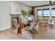 Bright living room and dining room area with fireplace, open floor plan and deck access through sliding glass doors at 1568 E Ashley Ave, Folly Beach, SC 29439