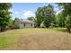 Expansive backyard view showcasing the home's exterior with solar panels and plenty of green space at 1578 Stanwick Dr, Johns Island, SC 29455