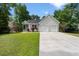 Beautiful home with a spacious driveway, well-maintained lawn, and lovely landscaping creating a welcoming entrance at 1578 Stanwick Dr, Johns Island, SC 29455