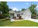 Inviting home showcasing a covered entryway, two-car garage, and lush lawn adding to its curb appeal at 1578 Stanwick Dr, Johns Island, SC 29455