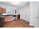 Functional kitchen with stainless steel appliances, granite countertops, wooden cabinets, and hardwood floors at 1578 Stanwick Dr, Johns Island, SC 29455