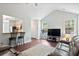 Bright living room with hardwood floors, comfortable couches, and great natural light from the windows at 1578 Stanwick Dr, Johns Island, SC 29455
