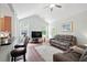 Comfortable living room with a large TV, hardwood floors, neutral paint, and a clear view to the kitchen at 1578 Stanwick Dr, Johns Island, SC 29455