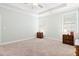 Bright main bedroom featuring a tray ceiling, neutral color scheme, and plush carpet for a cozy retreat at 1578 Stanwick Dr, Johns Island, SC 29455