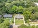 Lovely aerial view of the home with lush landscaping, mature trees and a well-kept lawn at 1593 Teague St, Charleston, SC 29407
