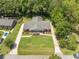 Aerial view of a charming home with lush greenery and a spacious front yard at 1593 Teague St, Charleston, SC 29407