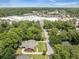 A high aerial view that shows the home in relation to a commercial shopping center nearby at 1593 Teague St, Charleston, SC 29407