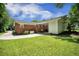 Expansive backyard with lush green lawn, brick and siding exterior, and a convenient carport for added functionality at 1593 Teague St, Charleston, SC 29407
