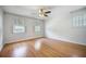 Bright bedroom featuring hardwood floors and ample natural light from multiple windows at 1593 Teague St, Charleston, SC 29407