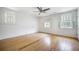 Inviting bedroom with three windows, hardwood floors, and ample natural light at 1593 Teague St, Charleston, SC 29407