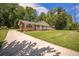 Charming brick home with a welcoming front porch and well-maintained landscaping at 1593 Teague St, Charleston, SC 29407