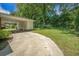 Spacious backyard with green grass and a covered parking area off the side of the home at 1593 Teague St, Charleston, SC 29407