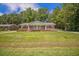 Straight on front view of a home with a long porch and ramp for handicap accessibility at 1593 Teague St, Charleston, SC 29407