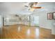 Bright, open kitchen featuring white cabinets, modern appliances, hardwood floors, and abundant natural light at 1593 Teague St, Charleston, SC 29407