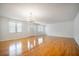 Bright living room with hardwood floors, chandelier, and natural light at 1593 Teague St, Charleston, SC 29407